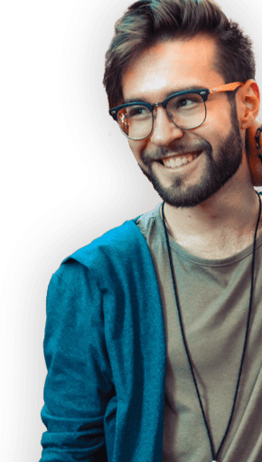 guy in sweater and glasses smiling 